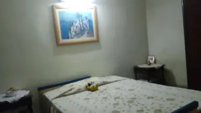 a bedroom with a bed with a banana on it at Sierras de Córdoba in Santa María