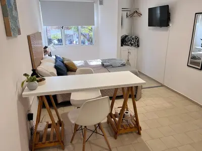 a living room with a table and a couch at Monoambiente para 2 personas Zona Centro in Cordoba