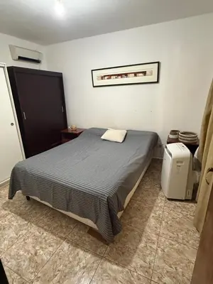 a bedroom with a bed in a room at El Algarrobo in Villa del Dique
