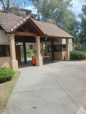 a building with a pavillion with a roof at Departamento amoblado de lujo con pileta y gym in Cordoba