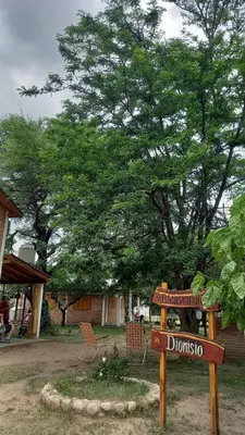 a sign that says durubbino in front of a tree at Cabañas Dionisio in Nono