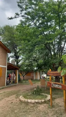 a sign for durubbio in front of a tree at Cabañas Dionisio in Nono
