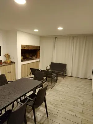 a room with tables and a piano in it at Casa Puerto del Águila Potrero de Garay in La Estancia