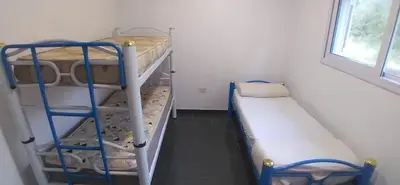 a room with two bunk beds and a ladder at Casa en Traslasierra in Los Hornillos
