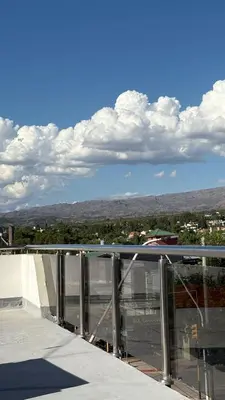 a balcony with a view of a city at Sol del Valle in Mina Clavero