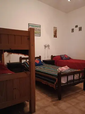 a bedroom with two bunk beds in a room at Los Bubos in Villa Los Aromos