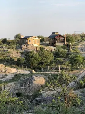a house on top of a hill with houses at Cabañas El Mirador in Calmayo