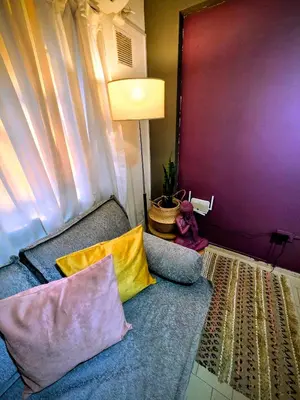 a living room with a couch with two pillows at Casa Morada in Cordoba