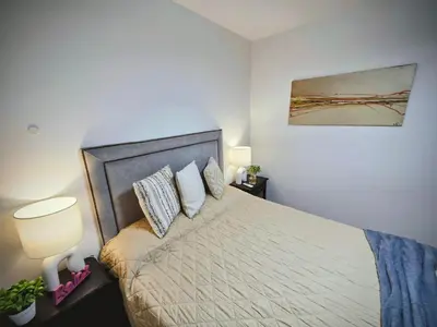 a bedroom with a bed and a painting on the wall at Casa Morada in Cordoba