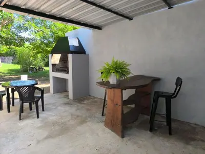 a patio with a table and chairs and a table and chairs at AlojaMenta in Nono