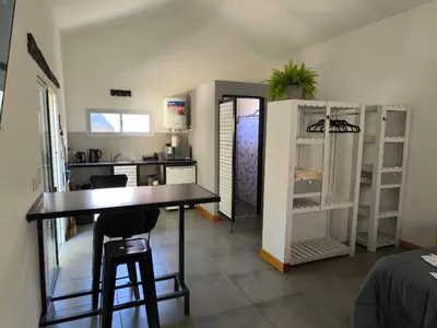 a kitchen with a table and chairs in a room at AlojaMenta in Nono