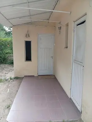 an empty room with a door in a building at casa en Tanti in Tanti