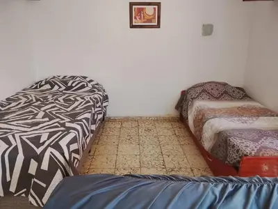 a room with two beds sitting next to each other at Majo in San Francisco del Monte de Oro