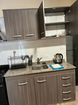 a kitchen with a sink and a counter top at El Atardecer in Trapiche