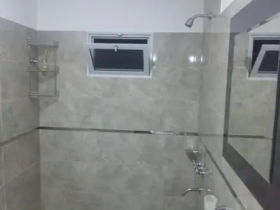 a bathroom with a shower with a window at Gabriel in Mina Clavero