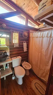 a bathroom with a toilet and a sink at Cabaña UMI - Un Mundo Infinito in Potrero de Garay