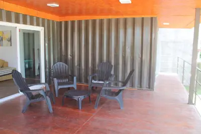 a group of chairs and a table in a room at Mirabela Casa con vista panorámica a las sierras en Bialet Massé- Hasta 4 personas in Bialet Massé
