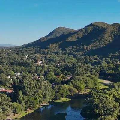an aerial view of a river with mountains at Posta Nativa in Santa Rosa de Calamuchita