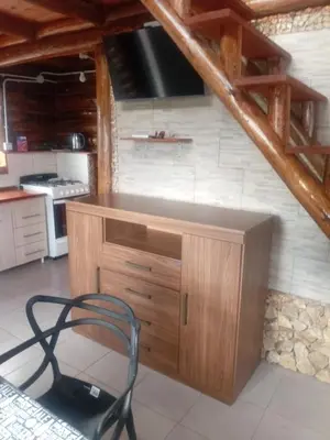 a kitchen with a desk and a chair in a room at Posta Nativa in Santa Rosa de Calamuchita