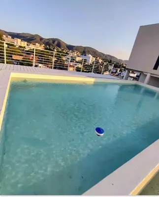 a swimming pool with a frisbee in the water at Sam Lake SL in Villa Carlos Paz