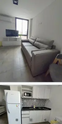 a living room with a couch and a refrigerator at Sam Lake SL in Villa Carlos Paz