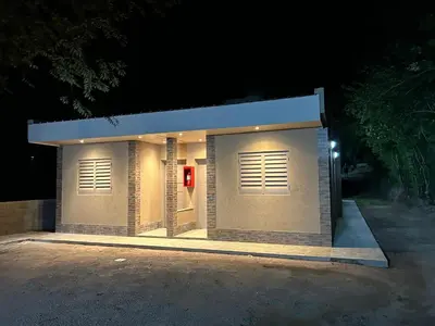 a small building with a red fire extinguisher at El Atardecer in Trapiche