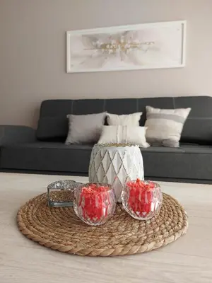 a table with two glass bowls and a vase at Veneto Village in Villa Parque Siquiman