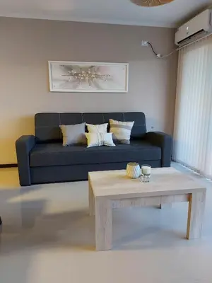 a living room with a couch and a coffee table at Veneto Village in Villa Parque Siquiman