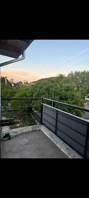 a view of a balcony with a fence and trees at El Nogal ll in Villa Carlos Paz
