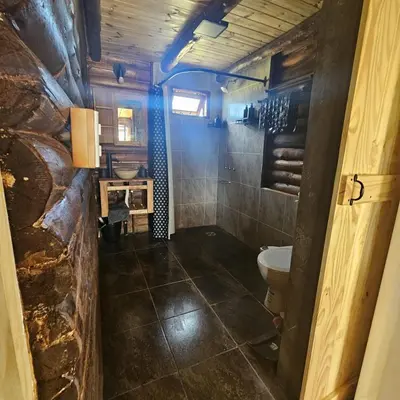 a bathroom with a toilet and a sink at Espacio Yacanto - Cabaña 1 in Villa Yacanto