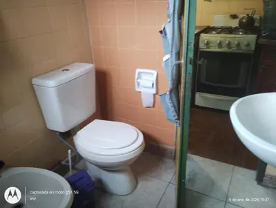 a bathroom with a toilet and a sink at 'Ña Emma in Cosquín