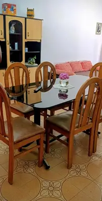 a dining room with a table and four chairs at Casa Santa Rosa de Calamuchita in Santa Rosa de Calamuchita