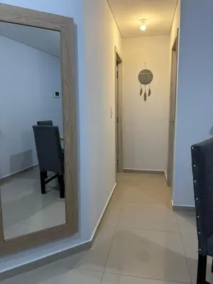 a mirror sitting on a wall next to a hallway at Calma Urbana in Cordoba
