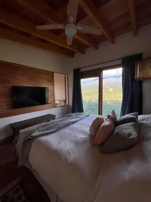 a bedroom with a large bed with a large window at Casa Estudio Japandi in San Javier