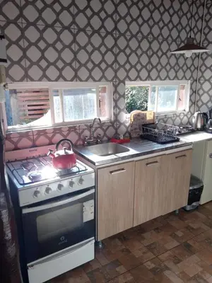 a kitchen with a stove and a sink at Espacio de relax in Trapiche