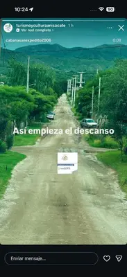 a dirt road with a sign in the middle at Can,19,Anisacate in Villa Anizacate