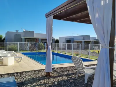 a view of the pool from the roof of a house at Cabañas NUEVA VIDA in Merlo