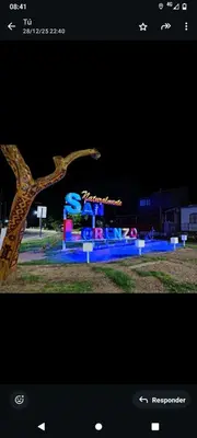 a picture of a statue in a park at night at Crespi in San Lorenzo