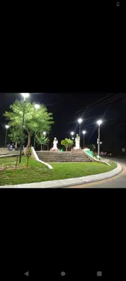 a street at night with street lights and trees at Crespito in San Lorenzo