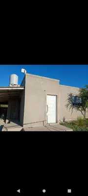 a building with a door in the side of it at Crespito in San Lorenzo