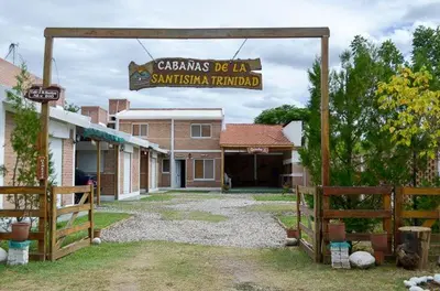 a sign for a santa barbara railroad in front of a building at Cabañas Santísima Trinidad in Villa Cura Brochero