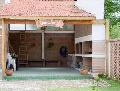 a building with a sign that says climbing on it at Cabañas Santísima Trinidad in Villa Cura Brochero