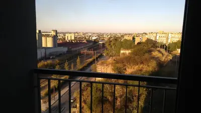 a view of a city from a balcony at Departamento a Pasos de la Terminal y Hospitales in Cordoba