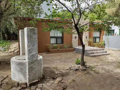 a building with a tree in front of it at Las Toribias II in El Rincón