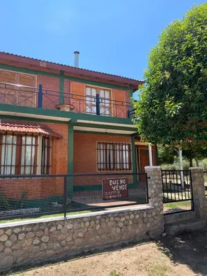 a house with a sign that says love for vampires at Casa Mi Sueño in Villa Cura Brochero