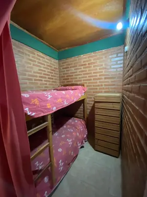 a small room with a bunk bed in it at Casa Mi Sueño in Villa Cura Brochero