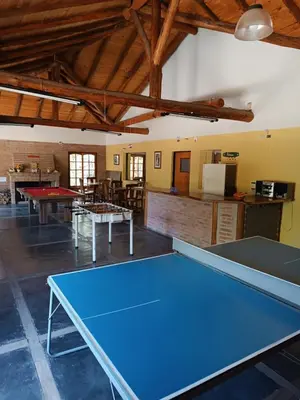 a large room with a ping pong table in it at Portal del Bosque in Villa Ciudad Parque