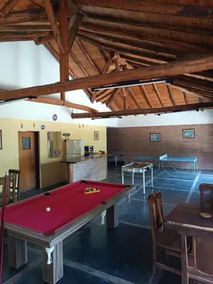 a pool table in the middle of a room at Portal del Bosque in Villa Ciudad Parque
