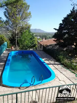 a swimming pool in the backyard of a house at La Casa del Zorzal in San Antonio de Arredondo