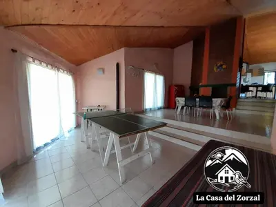 a living room with a ping pong table in it at La Casa del Zorzal in San Antonio de Arredondo